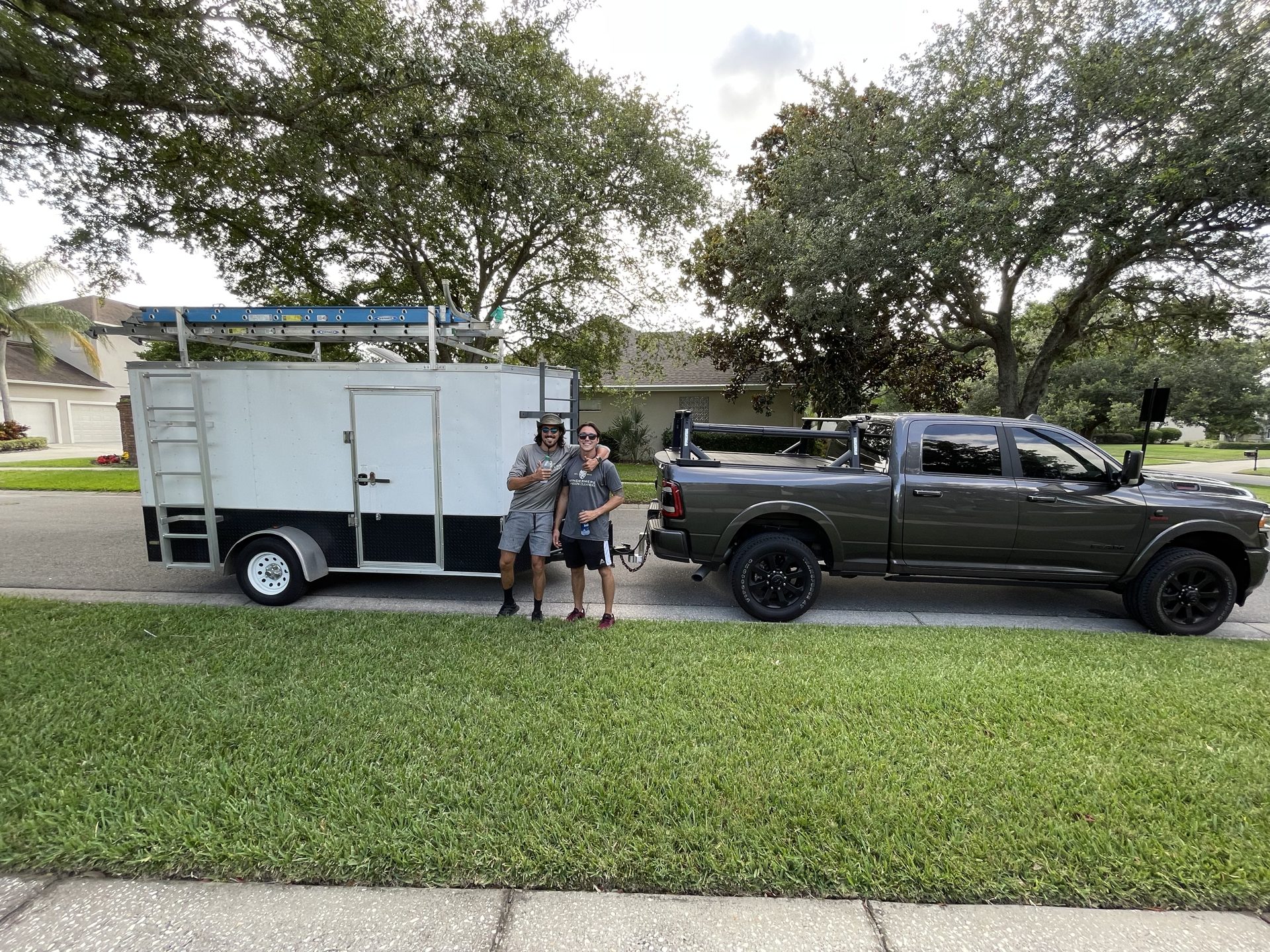 Windermere Window Cleaners truck and equipment trailer with two technicians